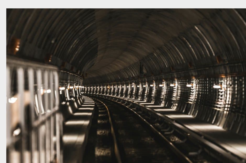 Lined civil-engineering tunnel receding into the distance